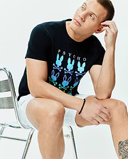 Mens Colt Graphic Tee, a black classic fit soft jersey t-shirt with a large chest graphic featuring PSYCHO text above gradient blue-green-purple bunny skull logos and crossbones. (4)