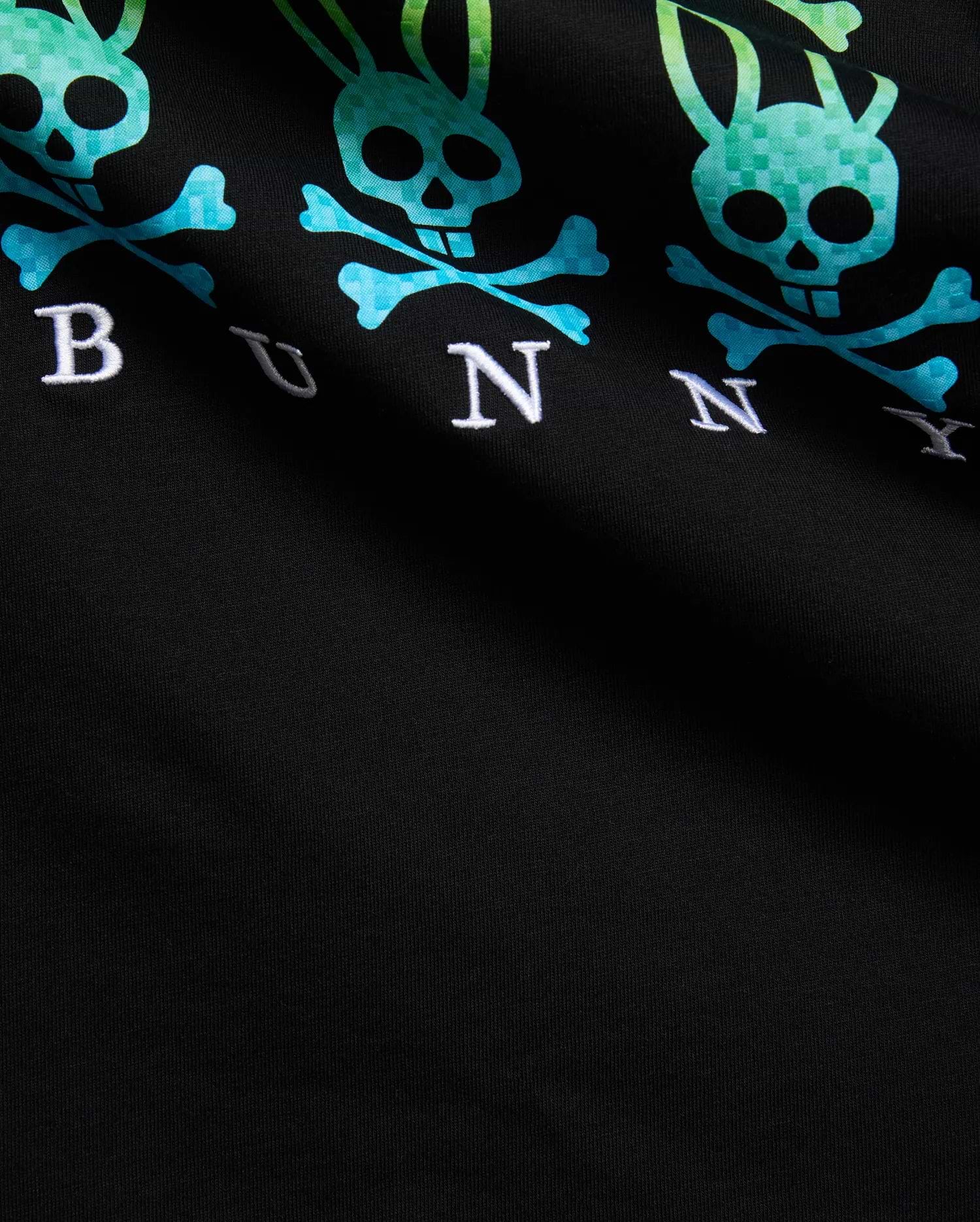 Black Mens Colt Graphic Tee with repeating gradient pixelated teal-to-green Psycho Bunny skull and crossbones graphic and embroidered white BUNNY text on soft jersey knit. (6)