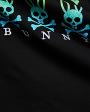 Black Mens Colt Graphic Tee with repeating gradient pixelated teal-to-green Psycho Bunny skull and crossbones graphic and embroidered white BUNNY text on soft jersey knit. (6)