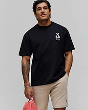 Black Mens Toby Oversized Tee, a relaxed fit in soft jersey knit, showcasing a bold white Psycho Bunny skull logo with PSYCHO BUNNY text on the left chest. (1)