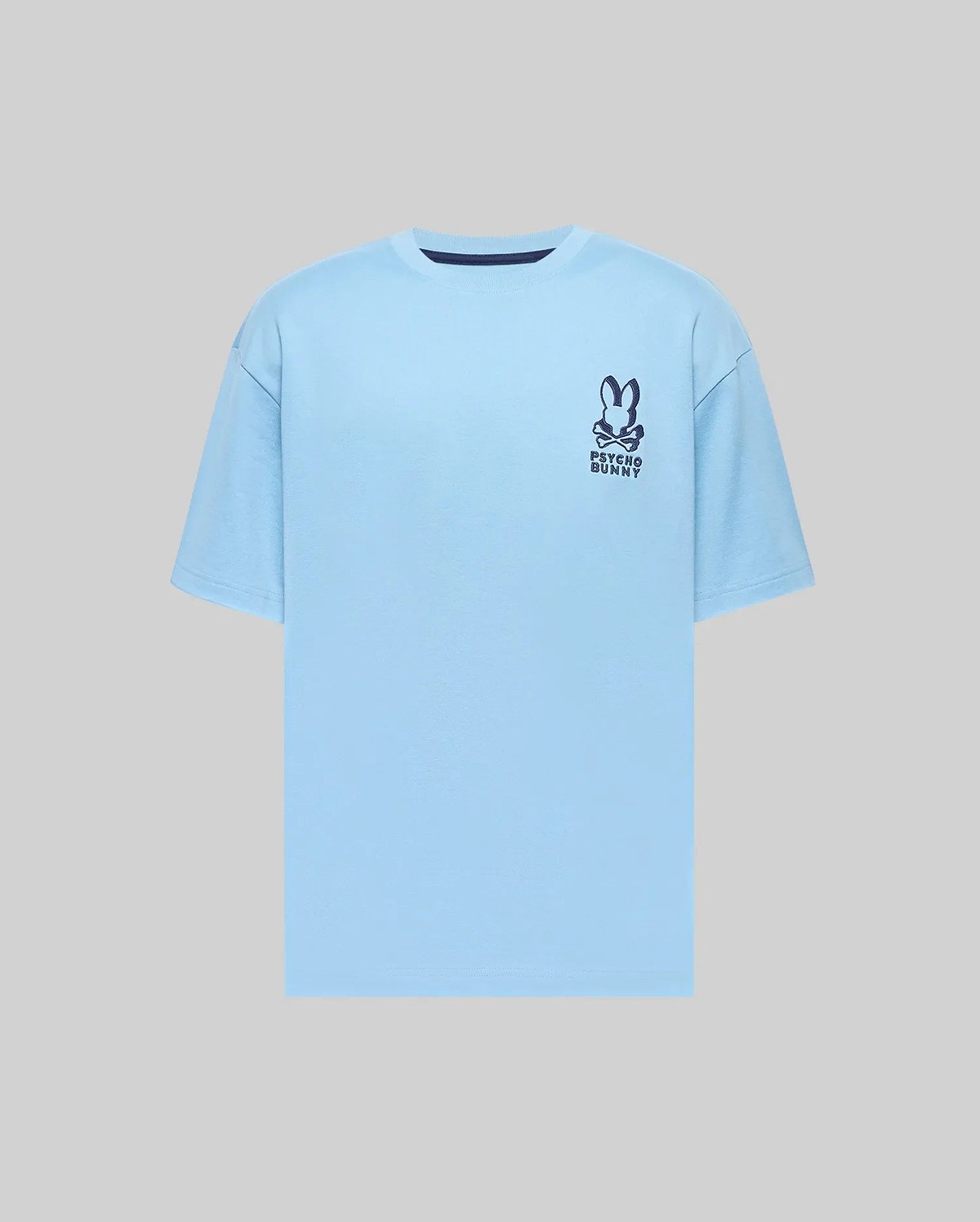 Mens Toby Oversized Tee in light blue jersey, featuring a relaxed fit and a dark blue Psycho Bunny skull logo with text on the left chest, plus a navy collar trim. (4)