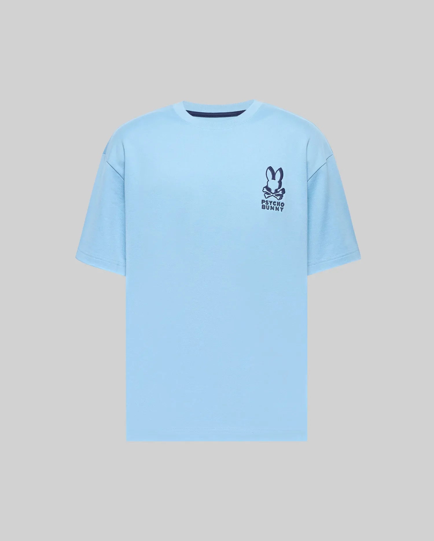 Mens Toby Oversized Tee in light blue jersey, featuring a relaxed fit and a dark blue Psycho Bunny skull logo with text on the left chest, plus a navy collar trim. (4)