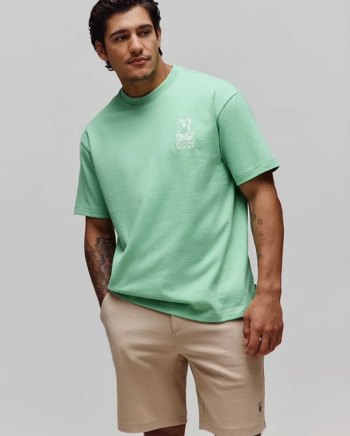 Mens Toby Oversized Tee in mint green, featuring a relaxed fit and soft jersey fabric. A white embroidered Psycho Bunny skull logo with text is prominently placed on the left chest. (1)
