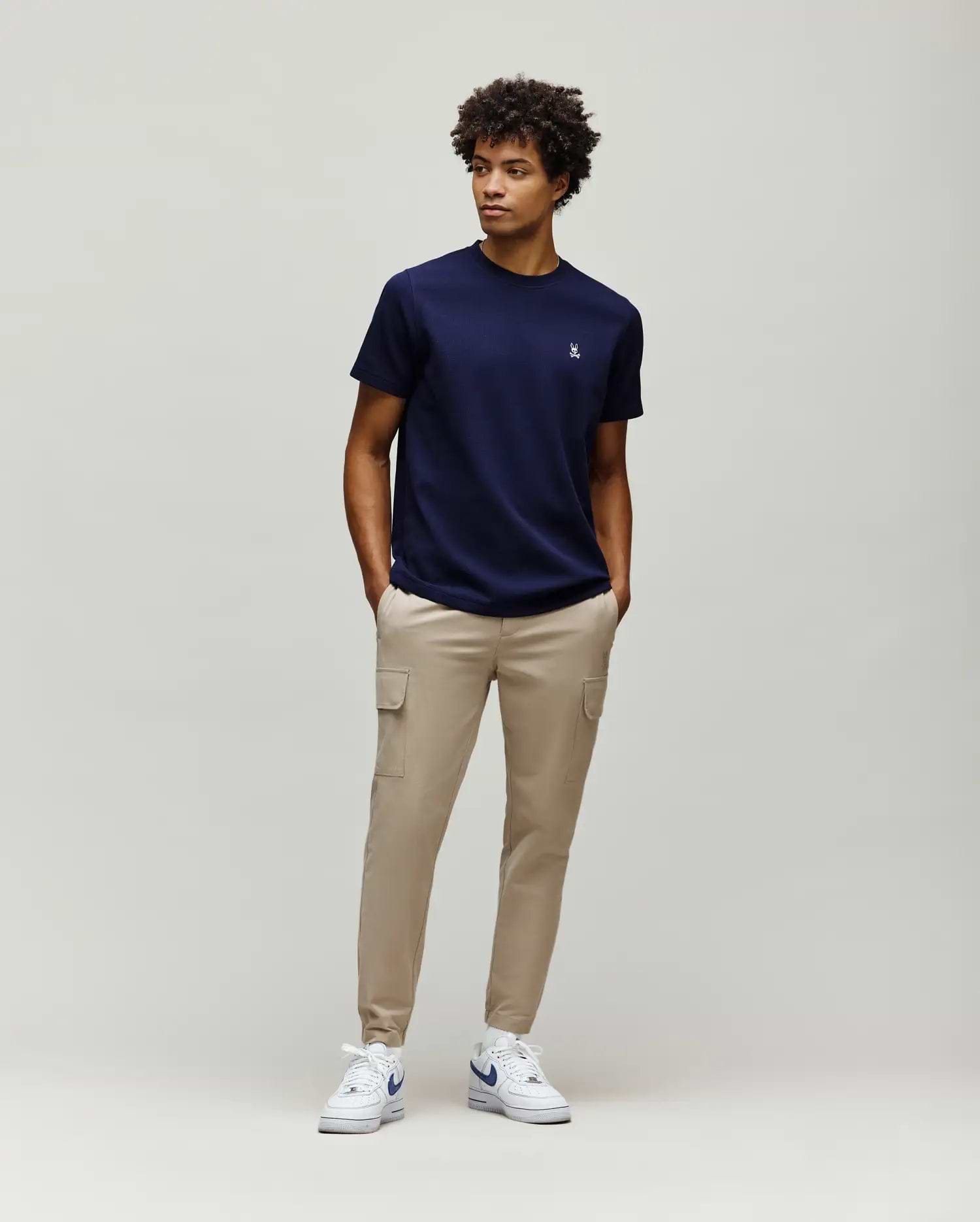 Navy blue Mens Maxton Waffle Tee with a classic fit, featuring a subtle waffle knit texture and a small white embroidered Psycho Bunny skull logo on the left chest. (4)