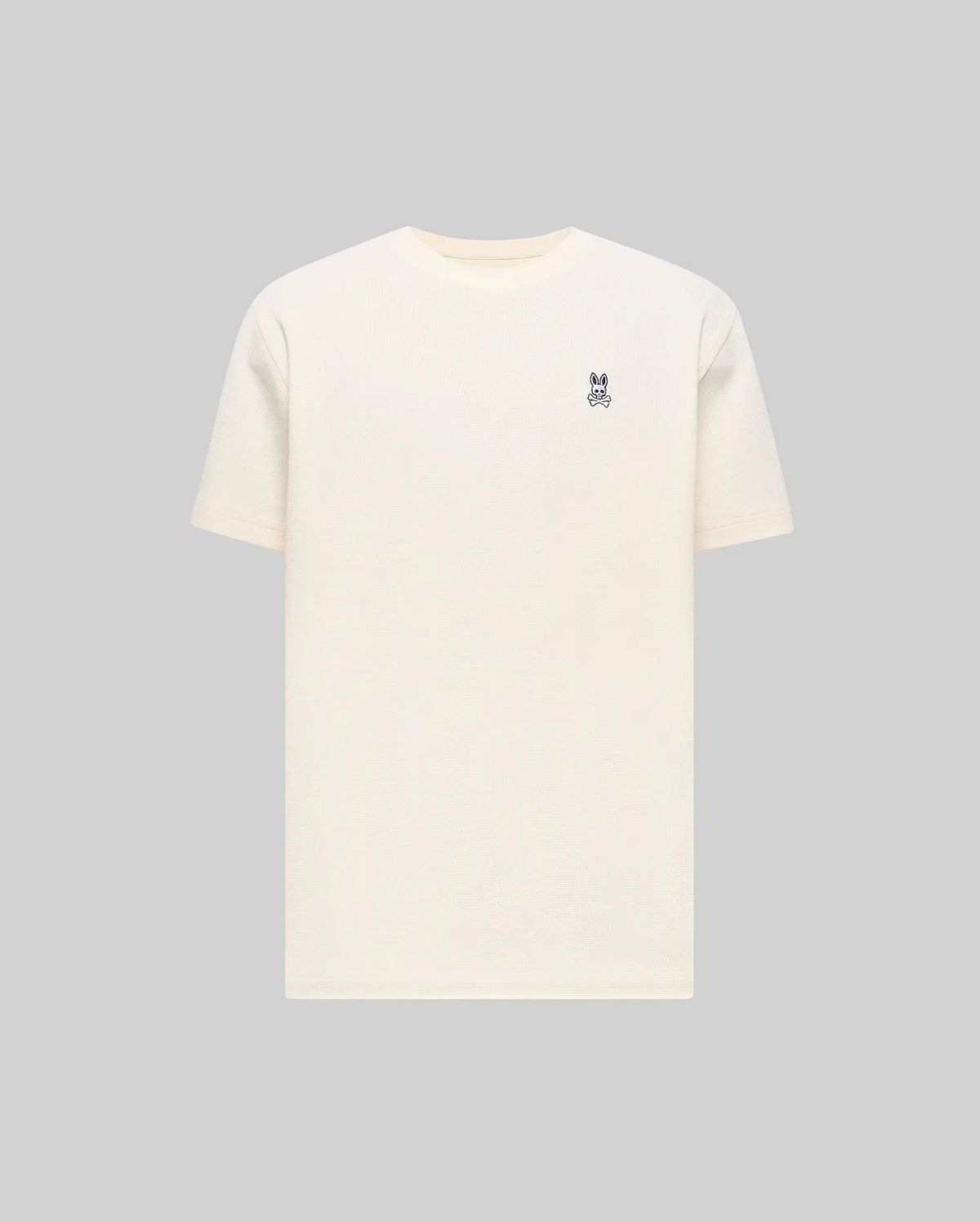 Mens Maxton Waffle Tee in cream, featuring a classic fit and a textured waffle knit fabric. Small embroidered navy Psycho Bunny skull logo on the left chest.