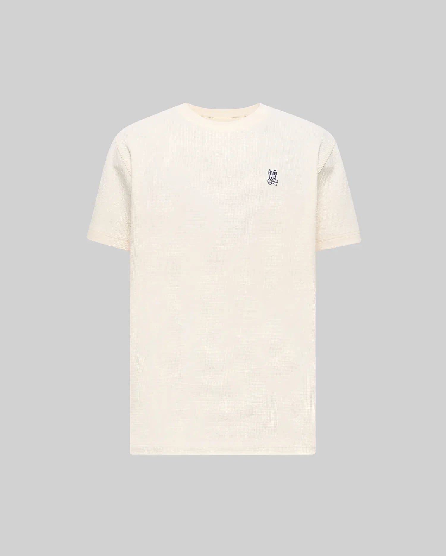Mens Maxton Waffle Tee in cream, featuring a classic fit and a textured waffle knit fabric. Small embroidered navy Psycho Bunny skull logo on the left chest.