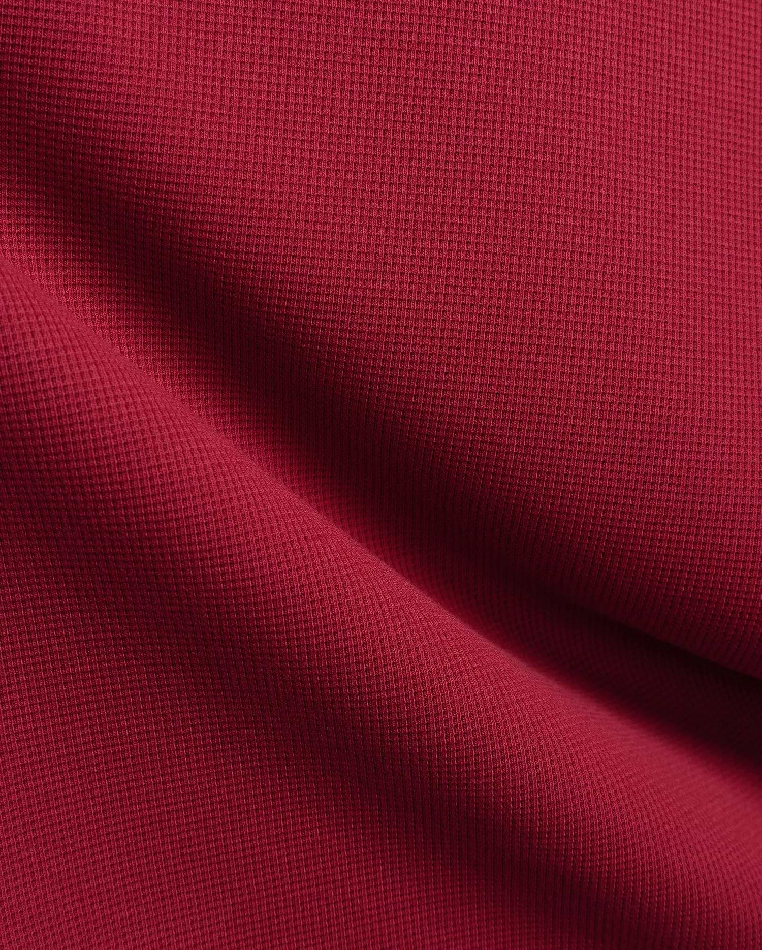 Burgundy Mens Maxton Waffle Tee, a premium streetwear staple crafted from soft, breathable waffle knit fabric, showcasing rich texture and the iconic small embroidered Psycho Bunny skull logo on the left chest.