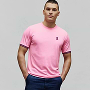 Mens Clark Performance Tee in bright pink, featuring a classic fit, smooth jersey knit, small fuchsia embroidered Psycho Bunny skull logo on the left chest, and navy and pink striped sleeve cuffs. (3)
