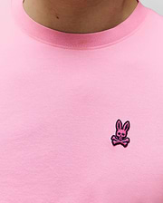 Mens Clark Performance Tee in vibrant pink, with a ribbed crew neck and a small, embroidered magenta and black Psycho Bunny skull logo on the left chest, crafted from a smooth jersey knit. (2)