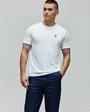 White Mens Clark Performance Tee, a classic fit performance jersey with a small blue embroidered Psycho Bunny skull logo on the left chest and blue and white striped ribbed cuffs. (3)