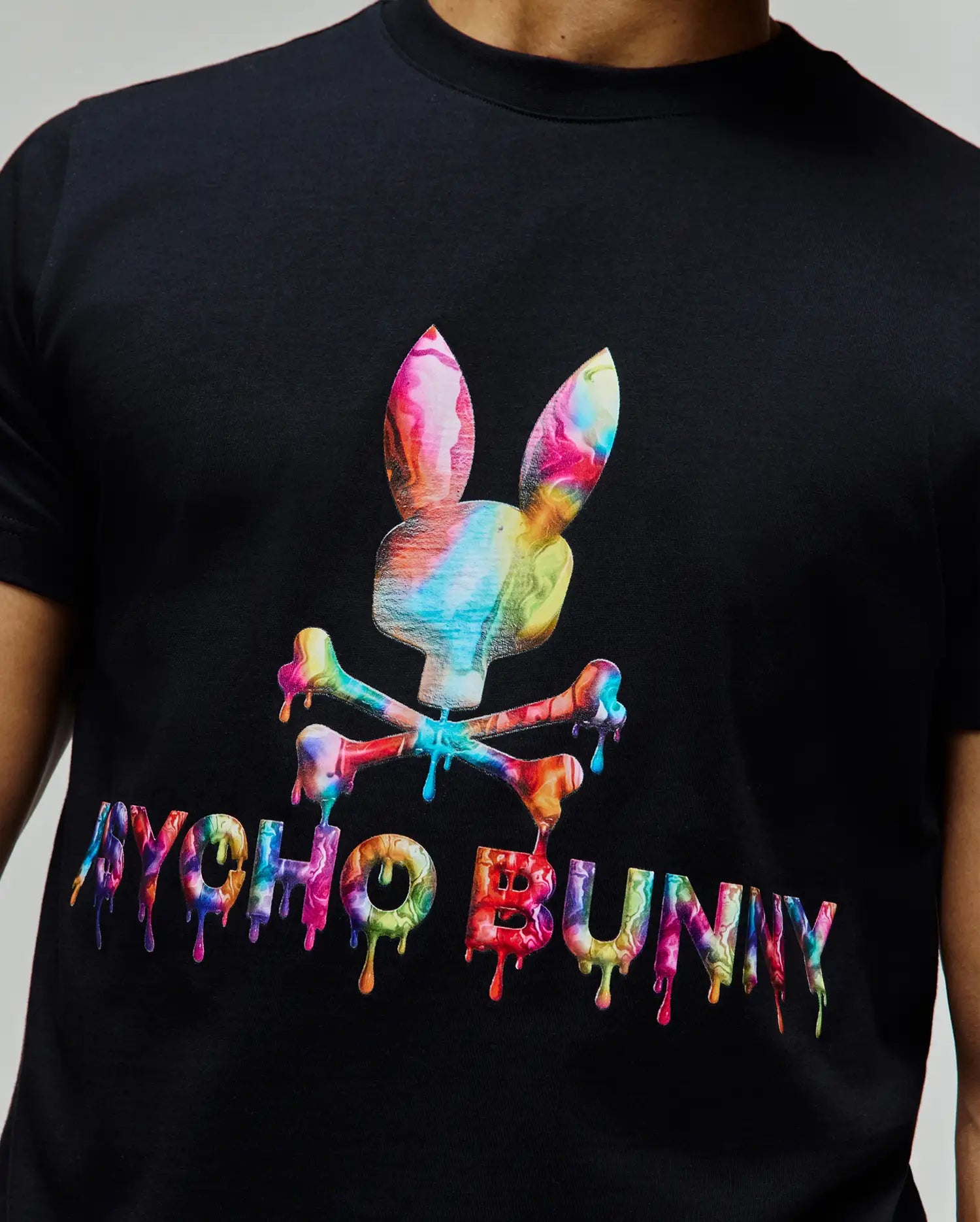 Mens Wells Graphic Tee, black classic fit jersey t-shirt featuring a large, vibrant multicolor dripping Psycho Bunny skull and crossbones graphic with matching melting Psycho Bunny text on the chest. (2)