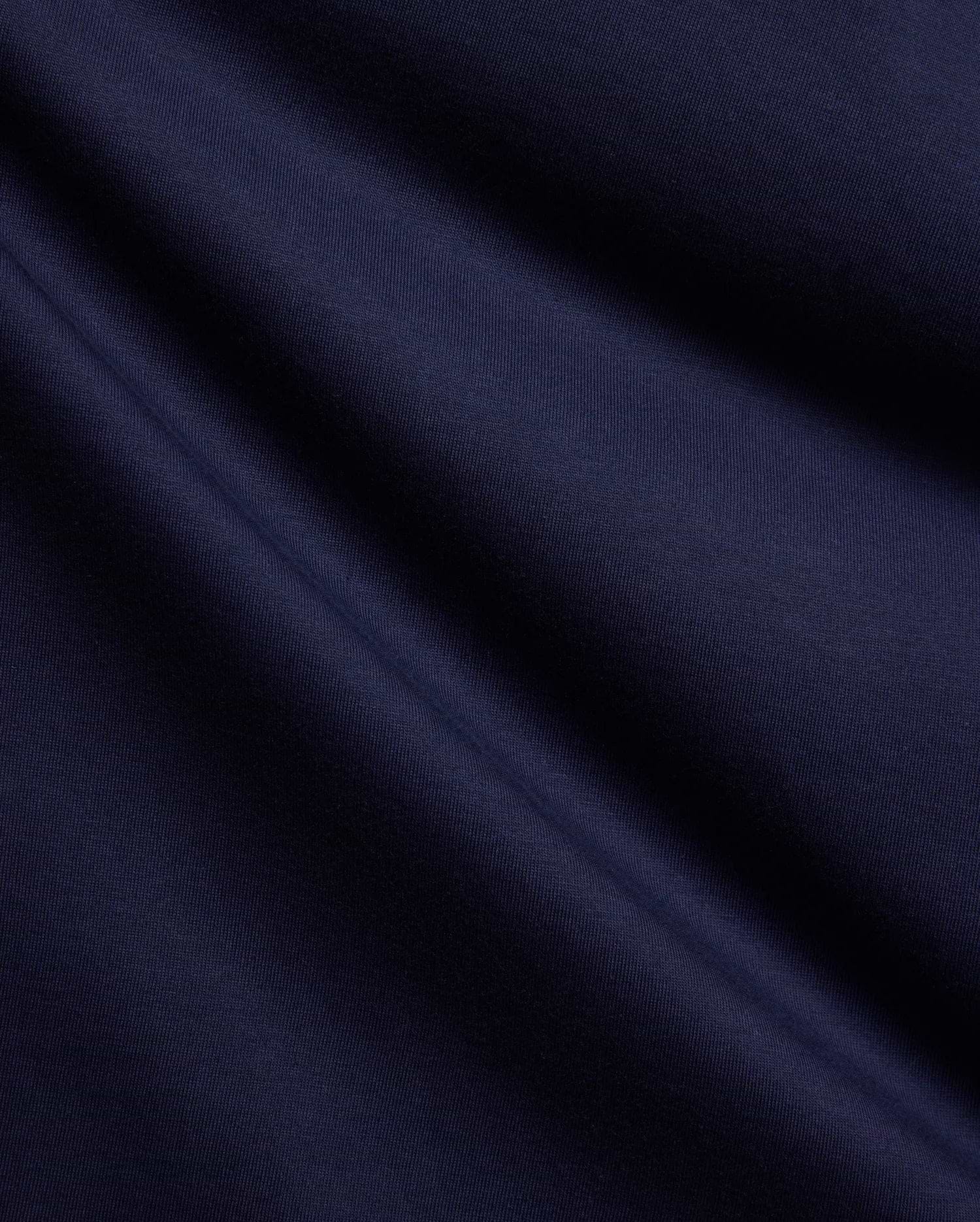 Premium Psycho Bunny Mens Holden Tee fabric swatch, showcasing a rich, deep navy blue color and a smooth, fine jersey knit texture with soft, flowing diagonal folds. (6)