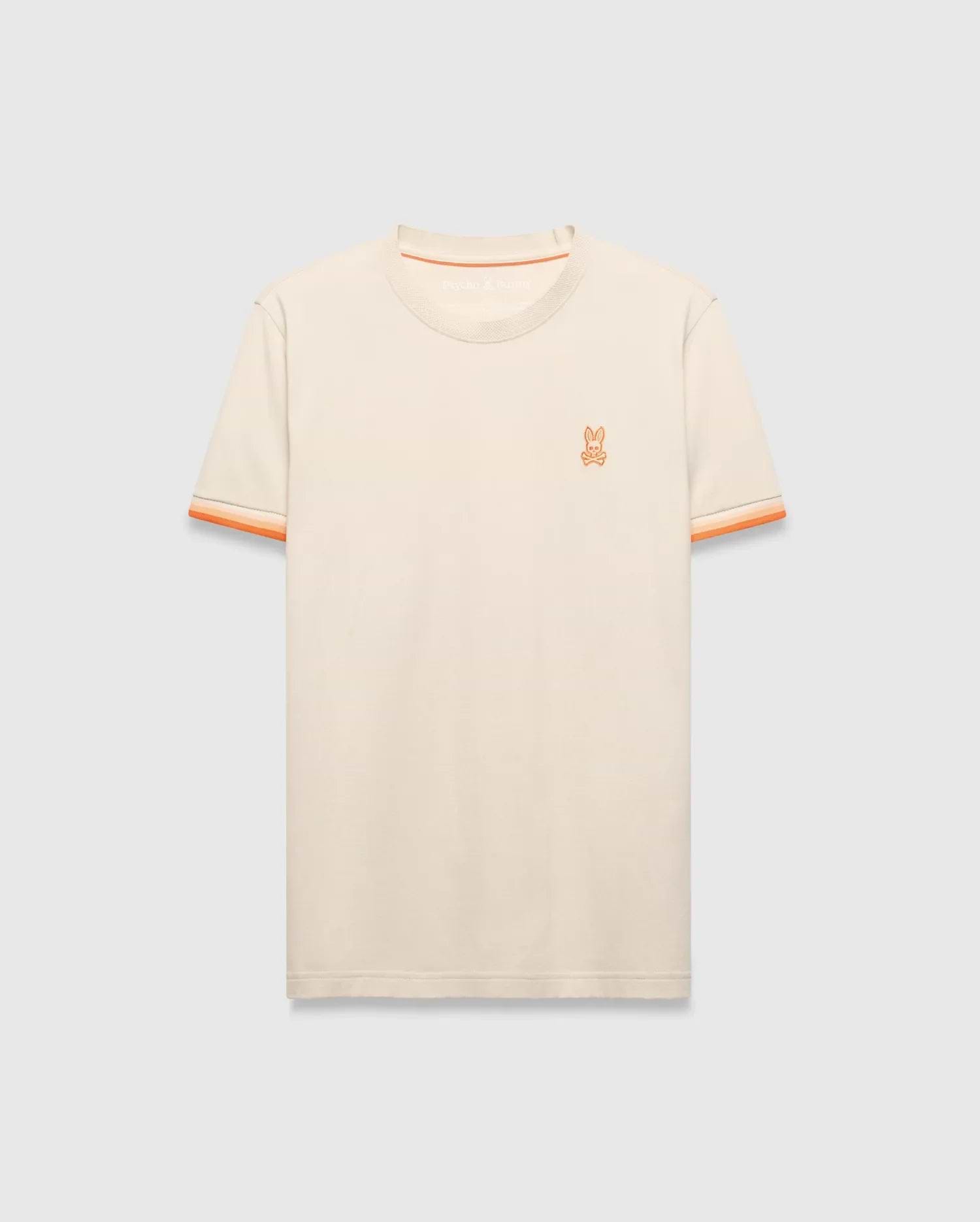 Mens Holden Tee, a classic fit cream jersey knit t-shirt with orange ribbed crew neck, striped sleeve cuffs, and small embroidered orange Psycho Bunny skull logo on left chest. (5)
