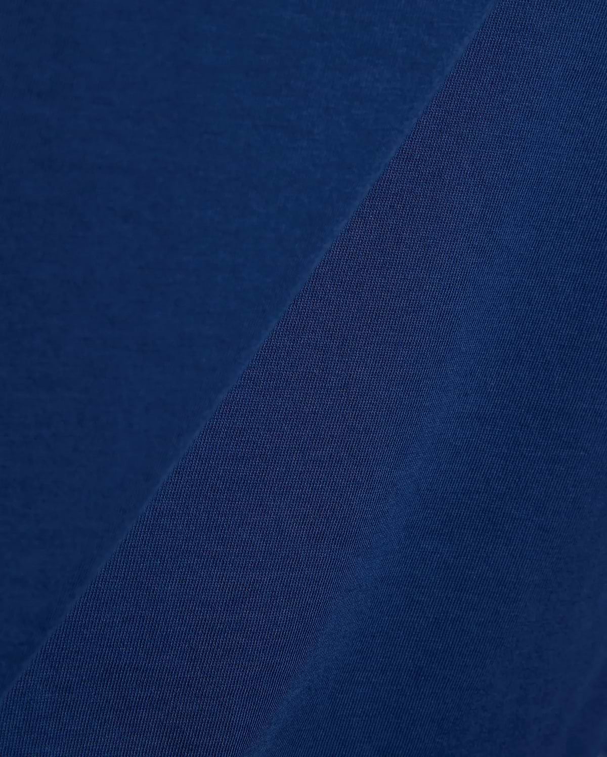 Mens Emmanuel Graphic Tee in rich navy blue, showcasing a soft, smooth jersey fabric on the main body, complemented by a finely textured, diagonal ribbed knit detail.