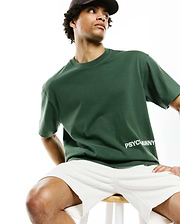 Mens Haiden Relaxed Heavy Weight Tee, a premium dark green jersey with a smooth texture, featuring the iconic white PSYCHOBUNNY text logo on the lower front.