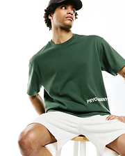 Mens Haiden Relaxed Heavy Weight Tee, a premium dark green jersey with a smooth texture, featuring the iconic white PSYCHOBUNNY text logo on the lower front.