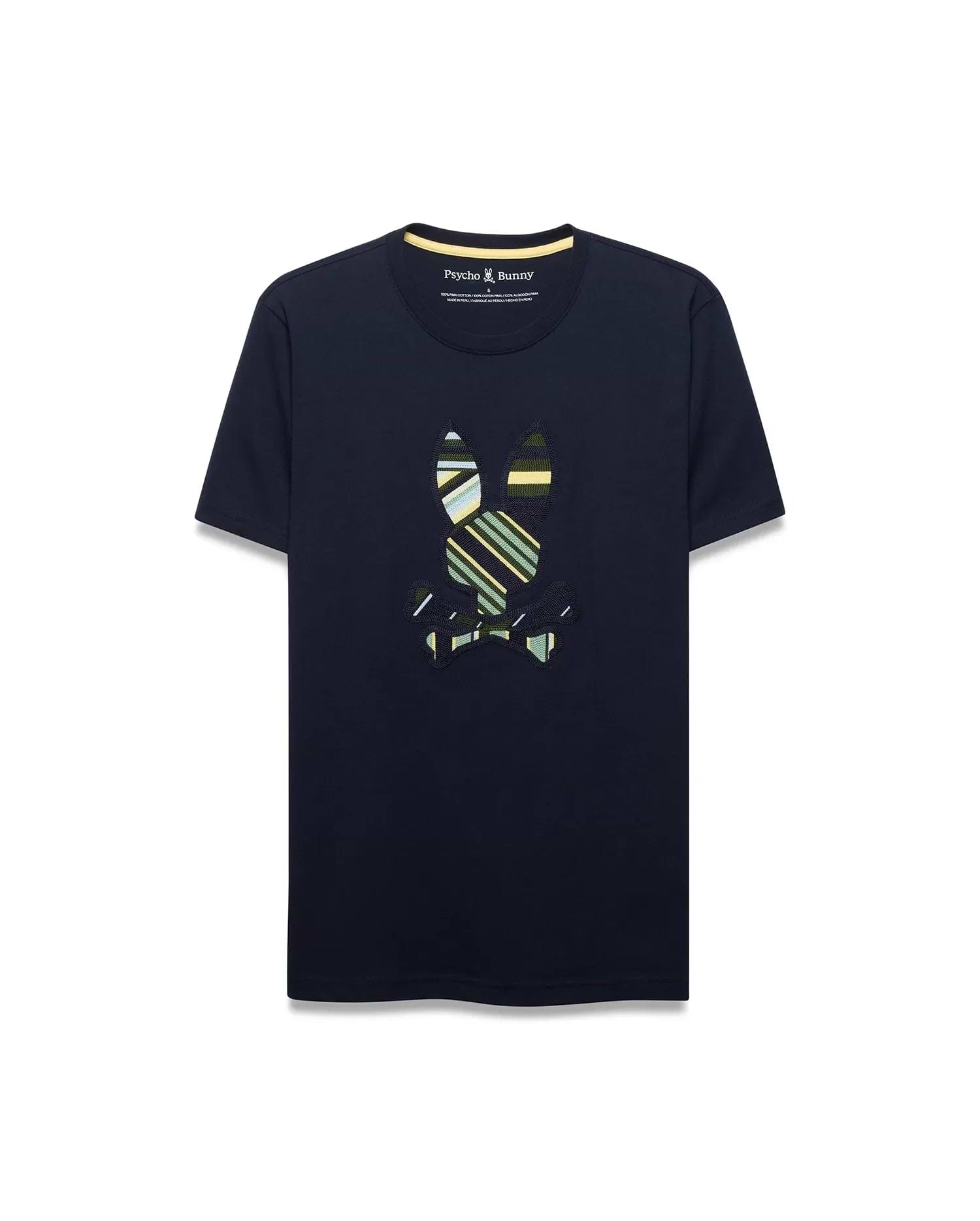Mens Drew Embroidered Graphic Tee, a navy classic fit jersey t-shirt with a large, center chest embroidered Psycho Bunny skull logo featuring bold green, yellow, and white stripes, and a yellow inner collar trim.