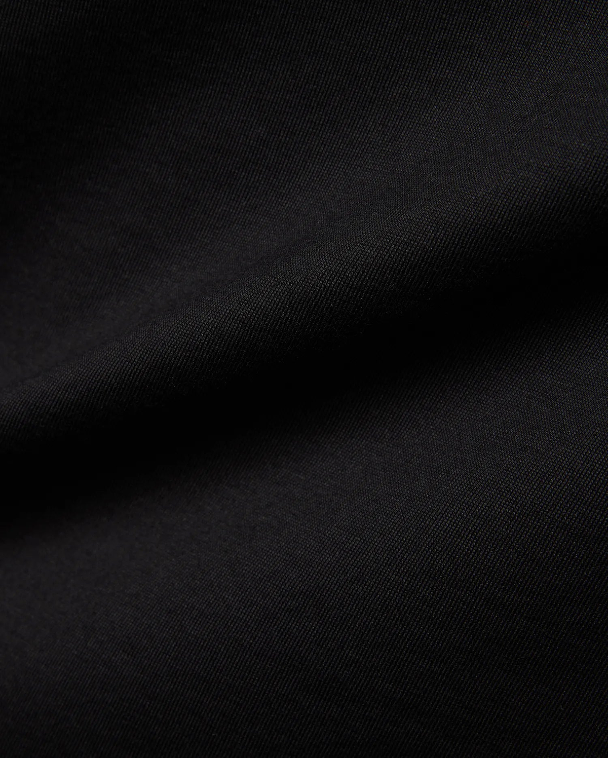 Mens Jaydon Wordmark Graphic Tee in classic black, crafted from soft jersey knit fabric with a subtle diagonal texture, featuring a bold wordmark graphic. (7)