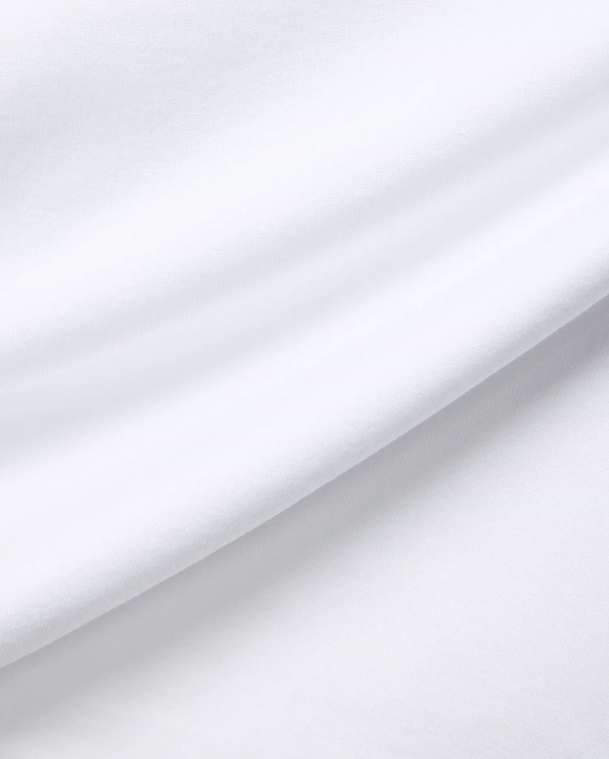 White MENS JAYDON RELAXED FIT TEE, a premium Psycho Bunny garment crafted from soft, breathable jersey fabric, showcasing subtle texture and gentle folds for ultimate comfort.