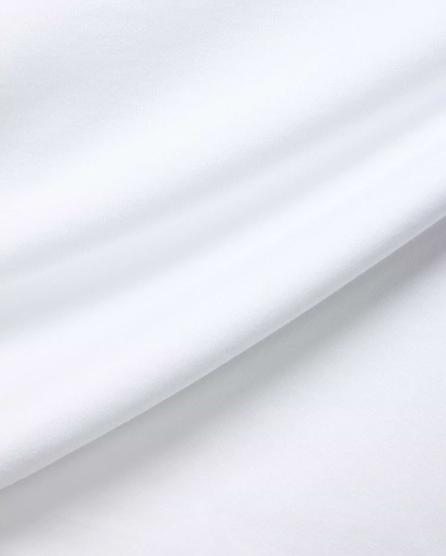 White MENS JAYDON RELAXED FIT TEE, a premium Psycho Bunny garment crafted from soft, breathable jersey fabric, showcasing subtle texture and gentle folds for ultimate comfort.
