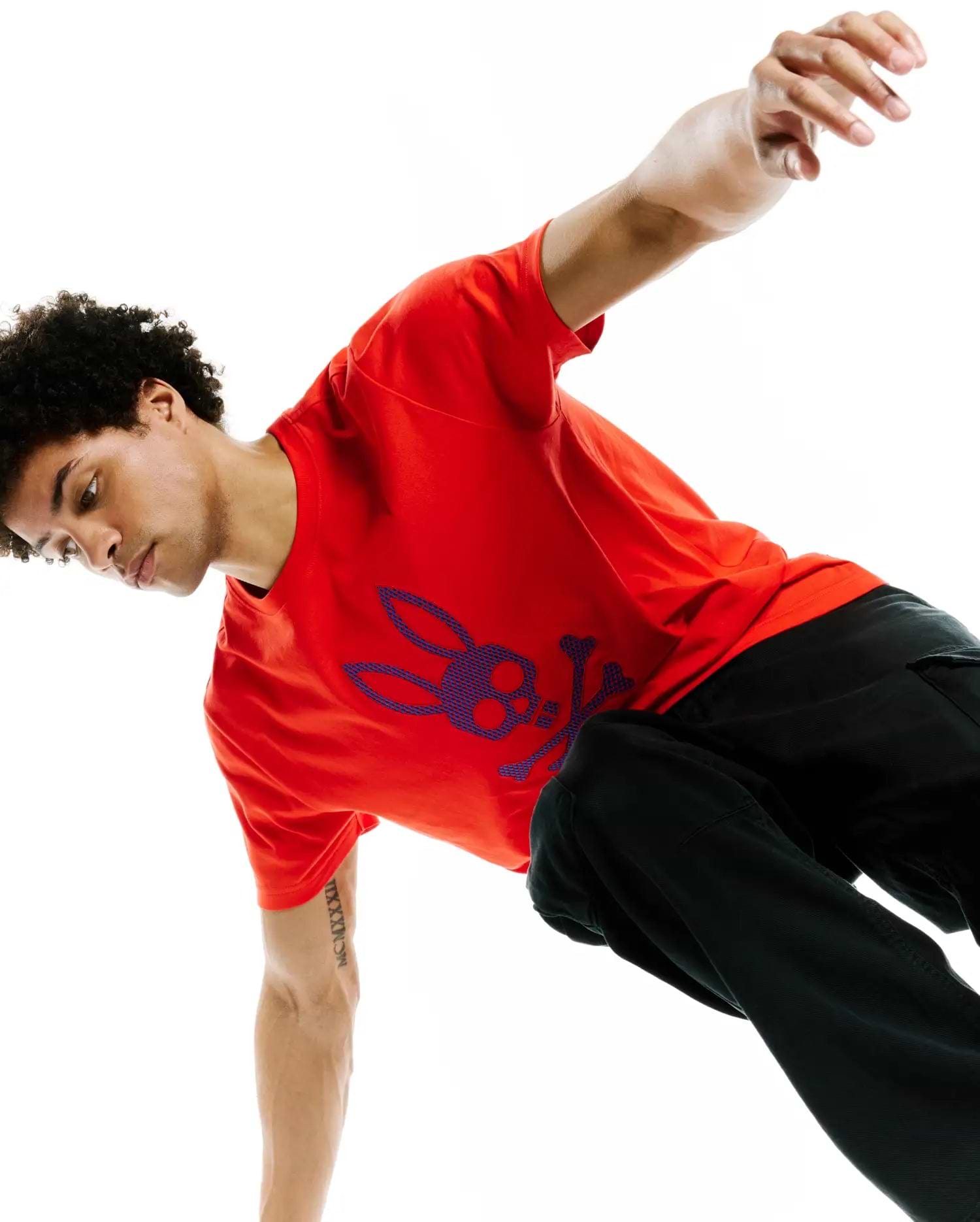 Mens Stan Graphic Tee in vibrant red, featuring a large, central textured blue and purple Psycho Bunny skull graphic on soft jersey knit, classic fit.