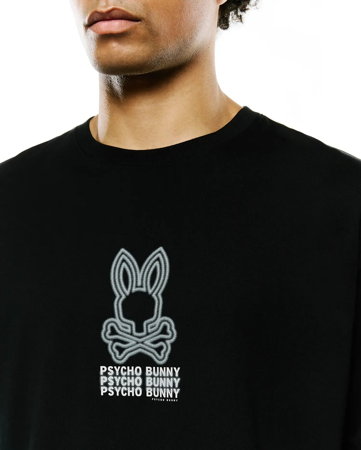 Mens Alex Relaxed Back Graphic Tee, a black jersey knit t-shirt featuring a large white outlined Psycho Bunny skull logo and stacked PSYCHO BUNNY text print on the chest. (4)