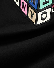 Mens Eddy Graphic Tee, black jersey t-shirt featuring a large, central, raised graphic of colorful block letters with black outlines, including pink N, blue Y, beige Y, and white O.