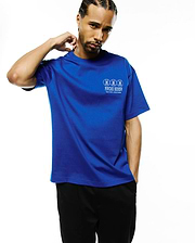 Mens Nathaniel Relaxed Fit Tee, royal blue jersey knit with a relaxed fit, featuring a white Psycho Bunny graphic print on the left chest with three bunny skulls and New York Since 2005.