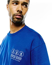 Royal blue Mens Nathaniel Relaxed Fit Tee in soft jersey knit, featuring a white embroidered left chest logo with three Psycho Bunny skull emblems and New York Since 2005 text.
