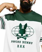 Mens Mike Graphic Jersey Tee, white with green color block. Features an embroidered green Psycho Bunny skull globe graphic, PSYCHO BUNNY text, and three bunny logos on the chest, with striped sleeves. (3)