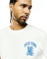 Mens Nathaniel Back Graphic Tee, a classic fit white jersey t-shirt with a large blue Psycho Bunny skull logo graphic featuring horizontal lines and arched PSYCHO BUNNY text on the chest.