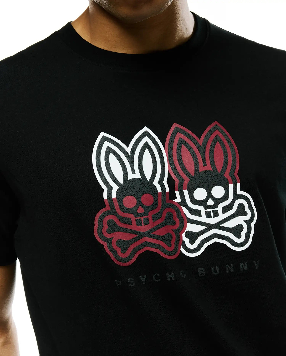 Mens Ledger Graphic Tee, a black jersey knit t-shirt with a classic fit, featuring a large textured chest graphic of two Psycho Bunny skull logos, one red and black, one white and black, with Psycho Bunny text below. (3)