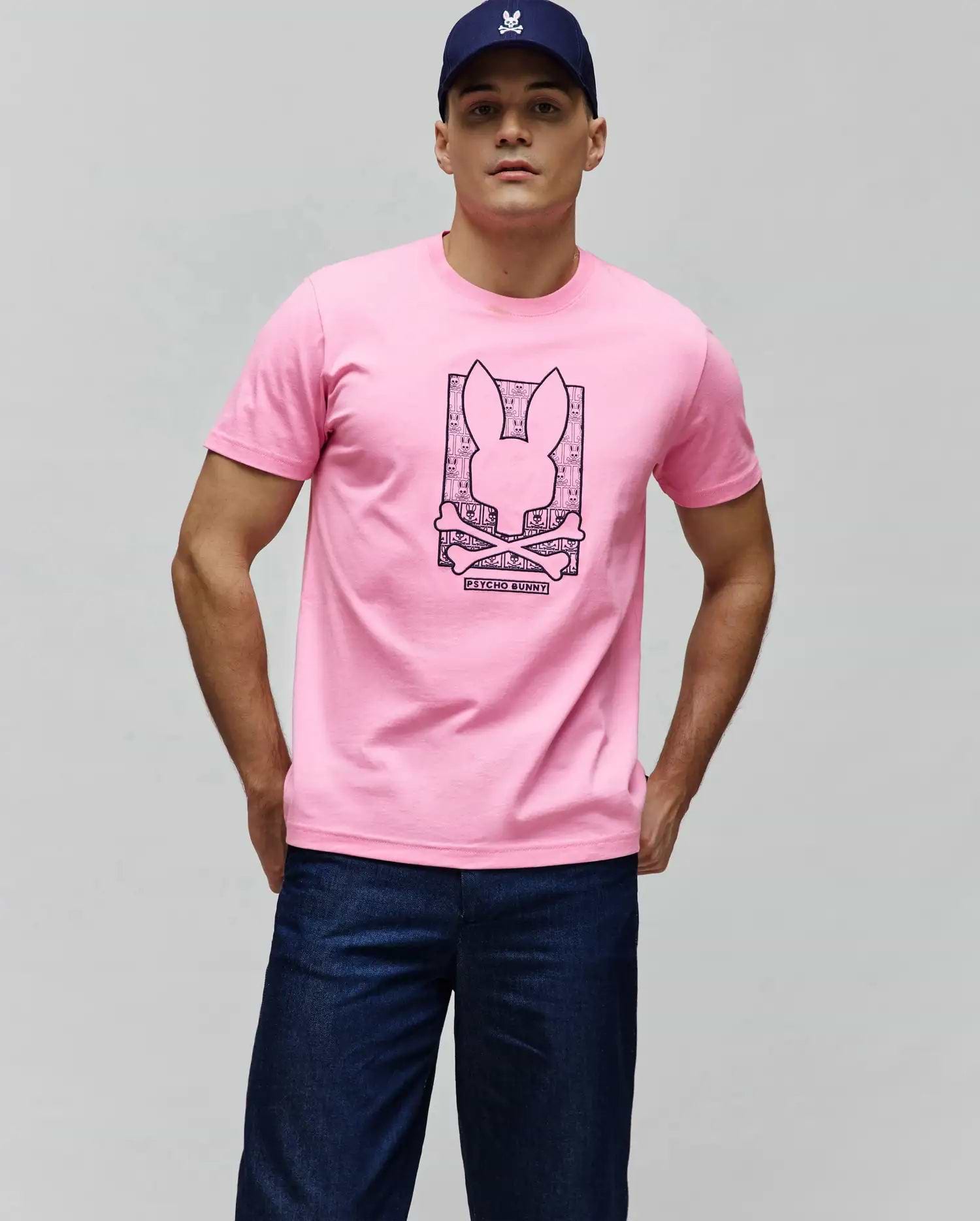 Mens Keon Embroidered Graphic Tee: Pink jersey t-shirt, classic fit, with a large dark pink central Psycho Bunny skull and crossbones graphic, framed by a mini skull pattern and Psycho Bunny text. (2)