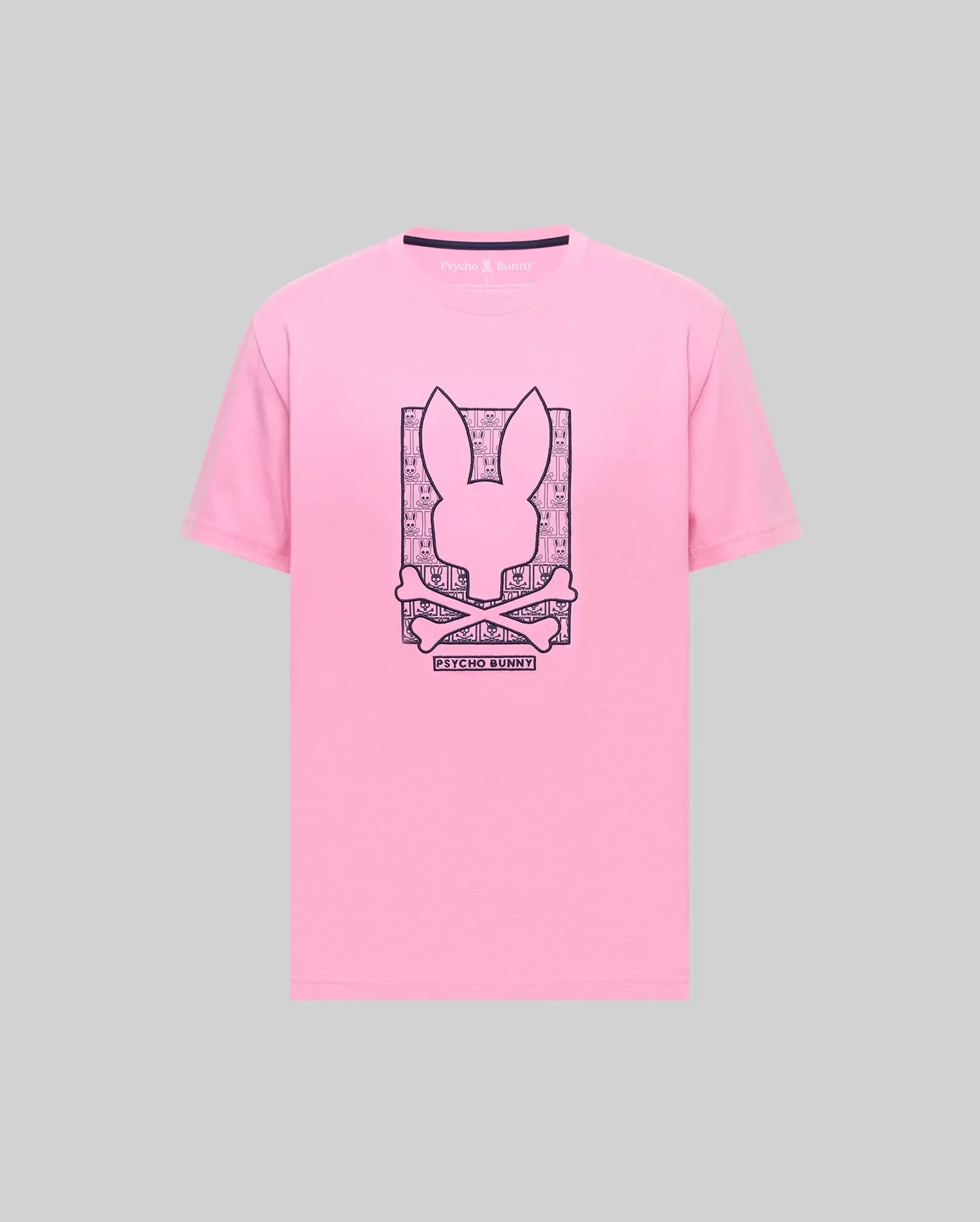 Mens Keon Embroidered Graphic Tee: Pink classic fit jersey t-shirt with a large dark blue embroidered Psycho Bunny skull and crossbones graphic on the chest, framed by smaller bunny skulls and Psycho Bunny text. (1)