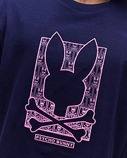 Navy classic fit jersey T-shirt with a large, central pink embroidered Psycho Bunny skull logo graphic, filled with a repeating mini bunny skull and crossbones pattern. Mens Keon Embroidered Graphic Tee. (3)