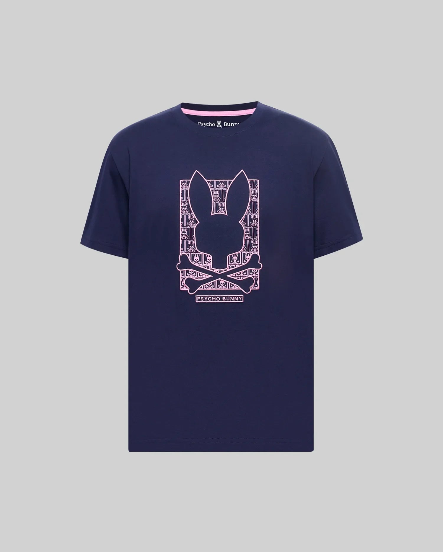 Navy classic fit jersey t-shirt with a large pink Psycho Bunny skull graphic on the chest, featuring a patterned background and pink inner neck trim. Mens Keon Embroidered Graphic Tee. (1)