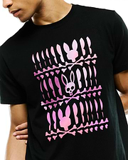 Mens Lewis Graphic Tee, a black classic fit jersey t-shirt featuring a large central pink gradient Psycho Bunny skull and crossbones graphic print in a repeated pattern.