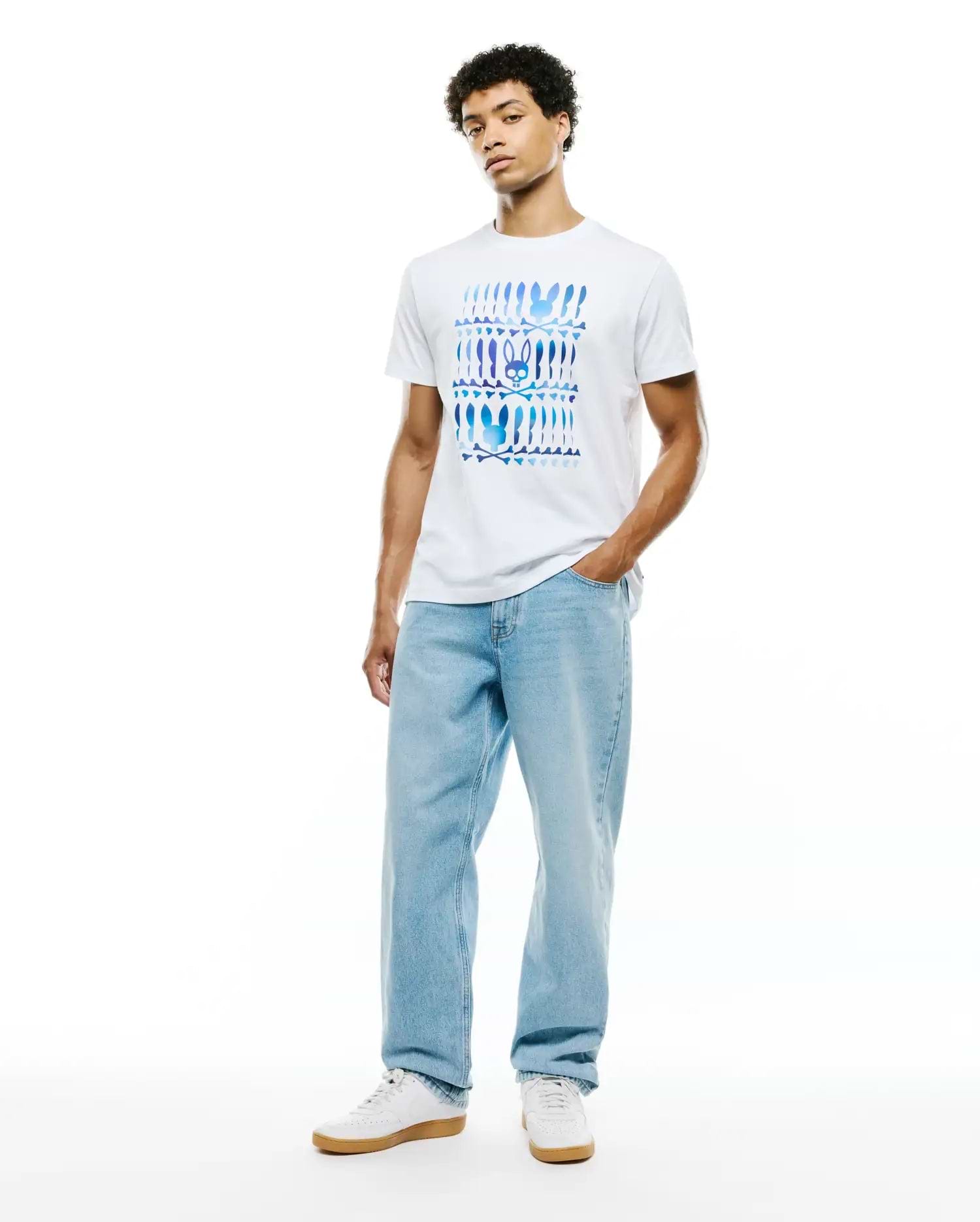Mens Lewis Graphic Tee, a classic fit white jersey t-shirt featuring a large chest graphic of repeating blue and purple gradient Psycho Bunny skull and crossbones motifs. (5)