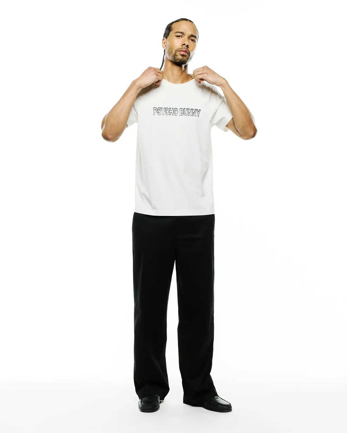 Mens Joji Wordmark Graphic Tee, a premium cream classic fit jersey t-shirt featuring a bold black outline PSYCHO BUNNY wordmark graphic prominently on the chest.