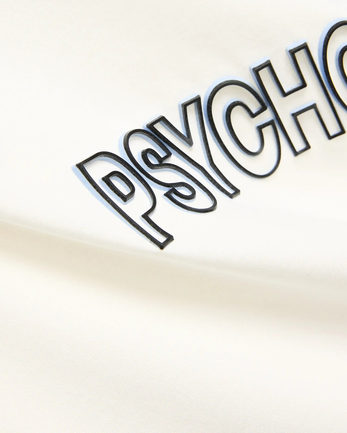 Mens Joji Wordmark Graphic Tee in cream, featuring a large central PSYCHO wordmark graphic with a black outline and light blue shadow effect on soft jersey knit fabric.