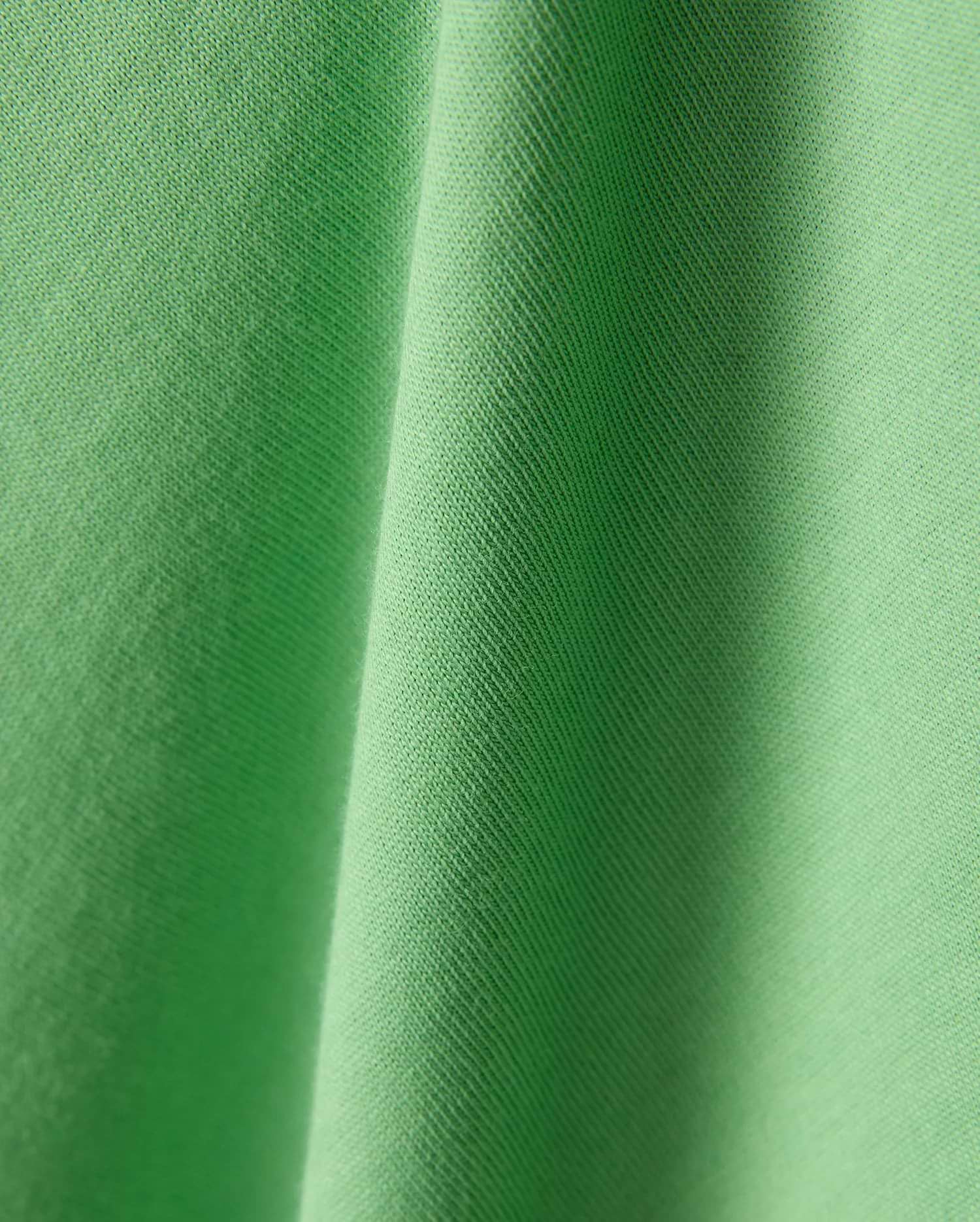 Mens Joji Wordmark Graphic Tee in a vibrant, eye-catching lime green jersey knit fabric, showcasing a fine, soft texture with subtle diagonal ribbing and elegant, flowing folds. (6)