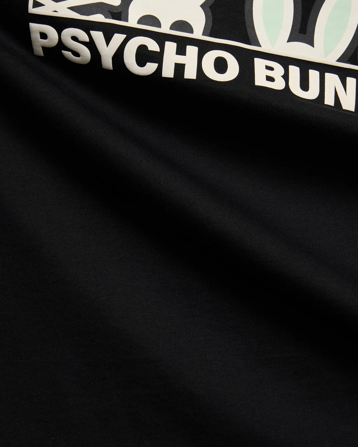 Mens Byron Graphic Tee, black jersey knit with a prominent white and mint green Psycho Bunny skull logo and bold PSYCHO BUNNY text graphic print on the chest. (6)