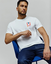 Mens Raphael Back Graphic Tee, a white classic fit jersey t-shirt featuring a small, vibrant Psycho Bunny skull and crossbones graphic on the left chest. (6)