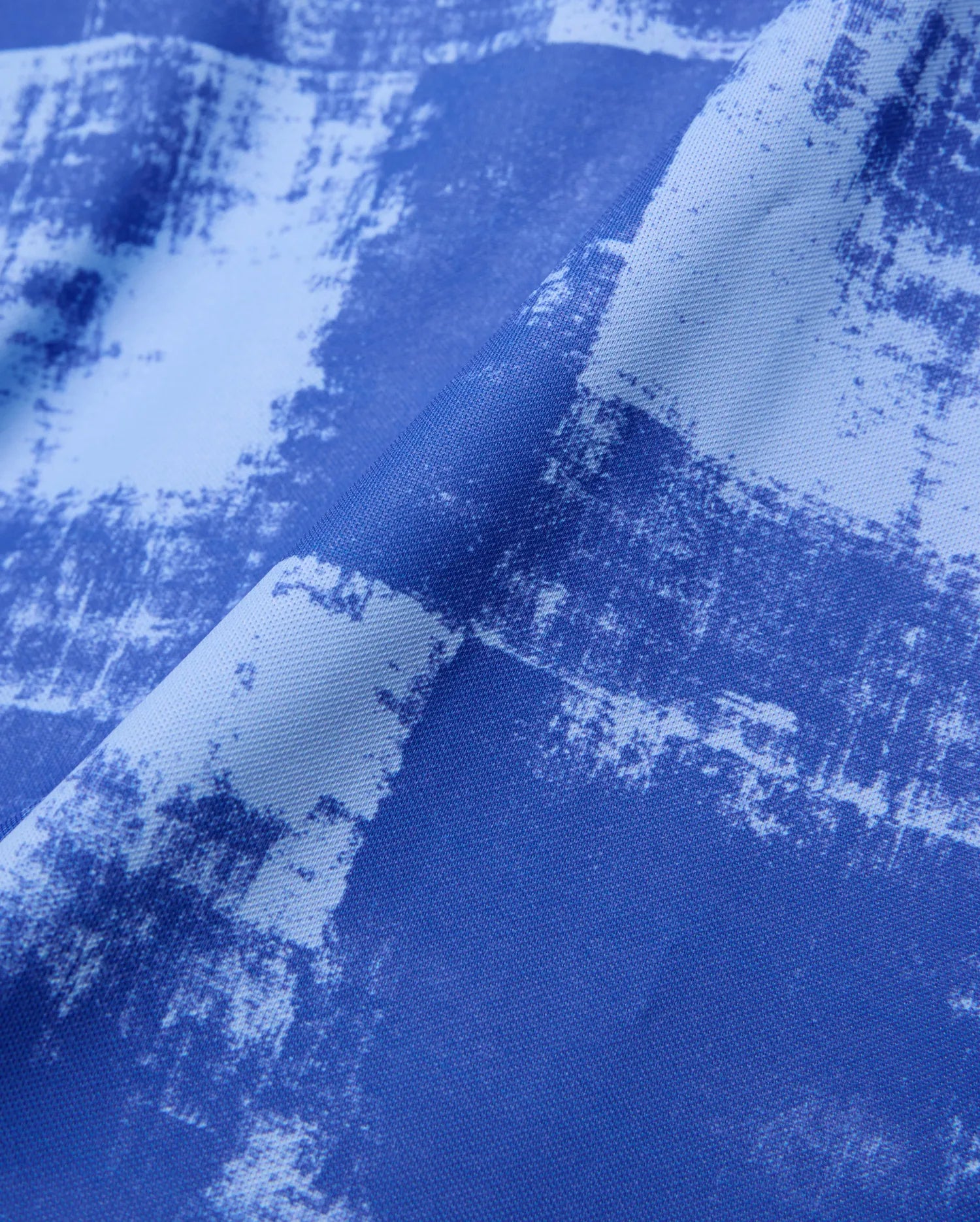 Mens Micah Oversized Soccer Jersey featuring a bold royal blue and light blue distressed abstract pattern on a textured performance fabric. (6)