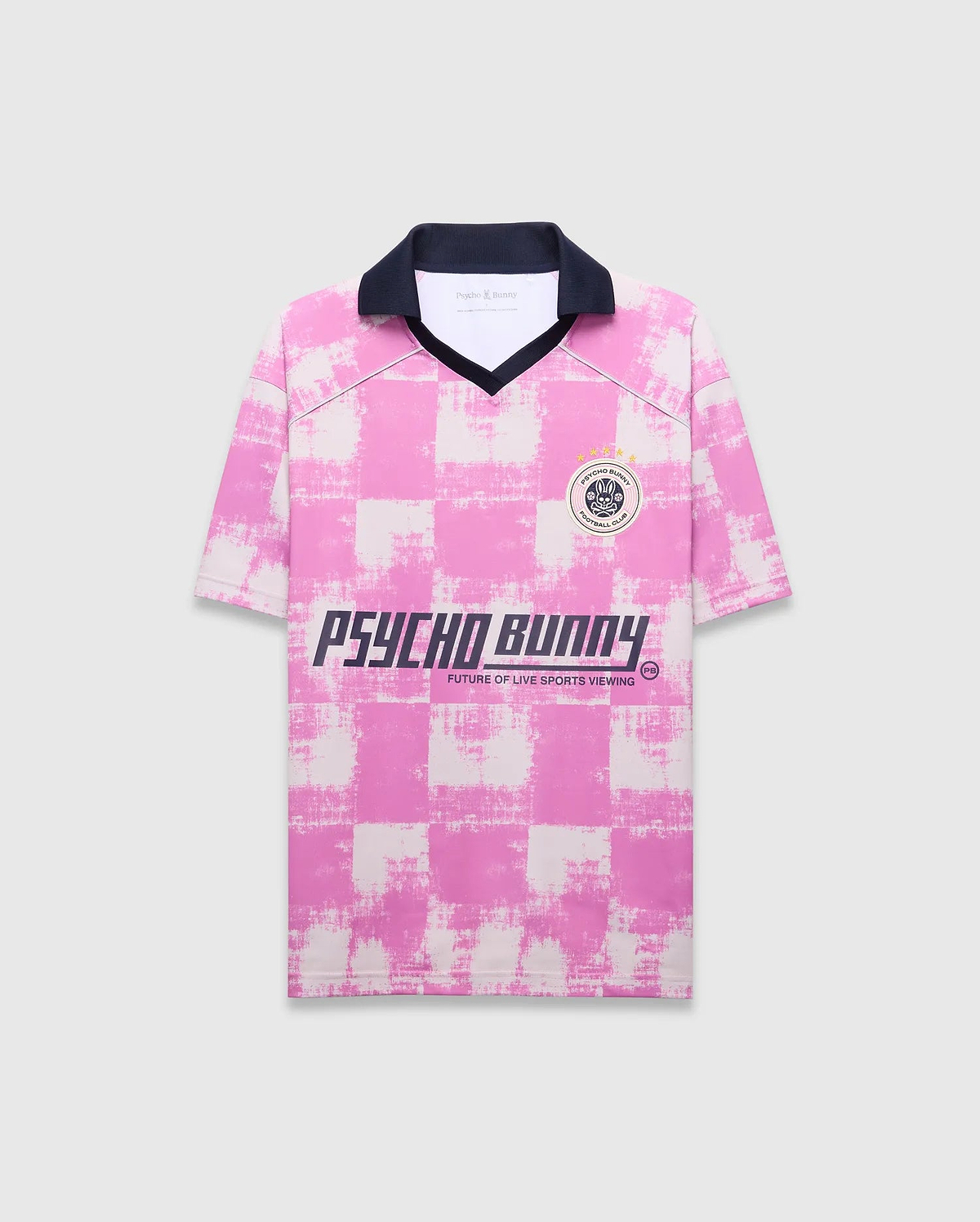 Mens Micah Oversized Soccer Jersey in pink and white distressed checkered jersey knit, featuring a navy collar, left chest Psycho Bunny Football Club patch, and large Psycho Bunny text graphic with Future Of Live Sports Viewing. (5)