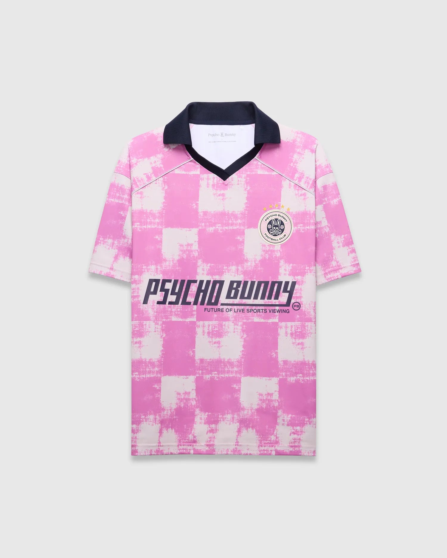 Mens Micah Oversized Soccer Jersey in pink and white distressed checkered jersey knit, featuring a navy collar, left chest Psycho Bunny Football Club patch, and large Psycho Bunny text graphic with Future Of Live Sports Viewing. (5)