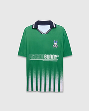 Mens Camden Oversized Soccer Jersey in green jersey knit, featuring a navy and white striped collar, small embroidered blue-eyed bunny skull logo on left chest, large white PSYCHOBUNNY graphic, and fading vertical green and white stripes. (5)