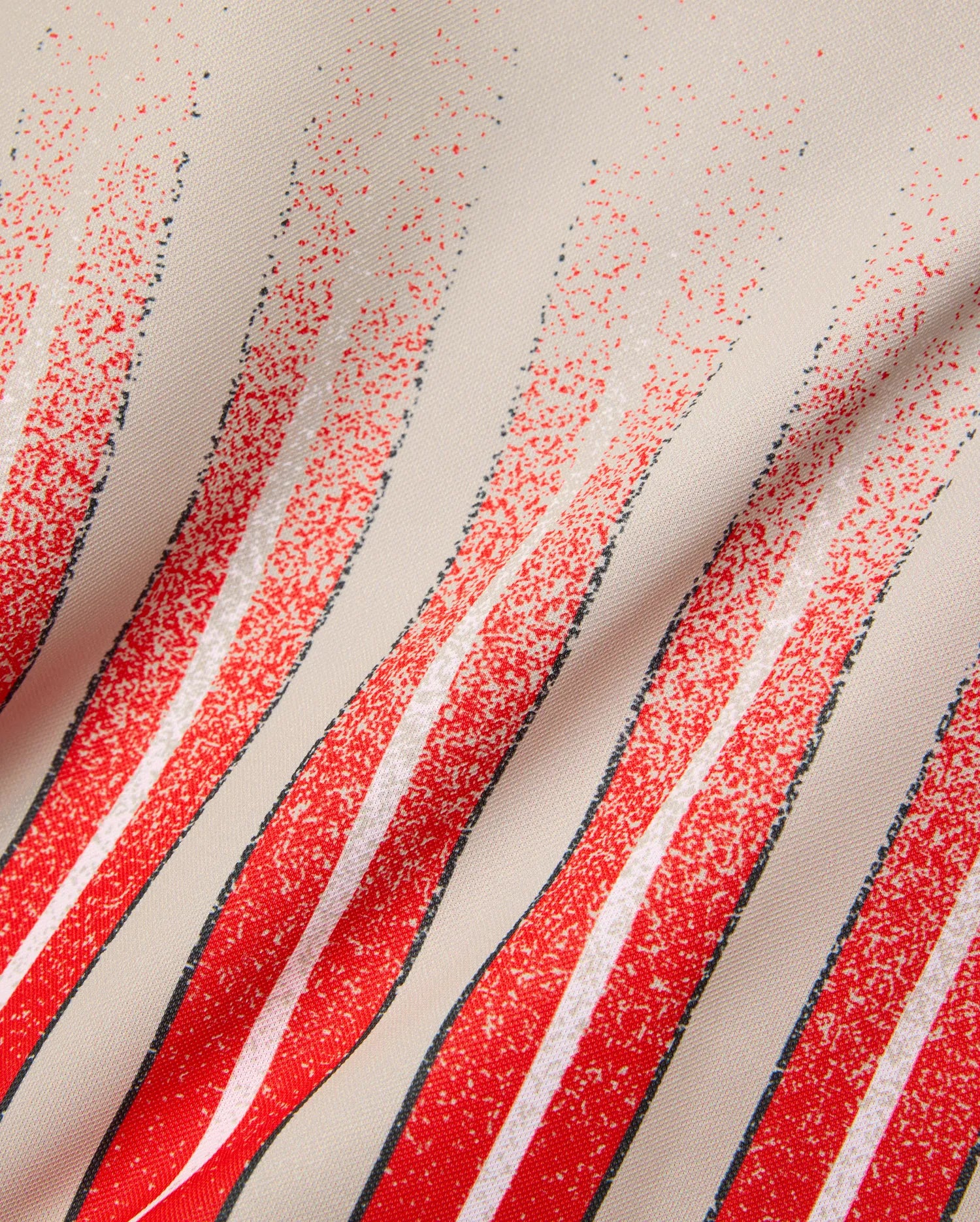 Mens Camden Oversized Soccer Jersey in beige jersey knit, featuring bold red, white, and black distressed vertical stripes with a speckled fade effect. (6)
