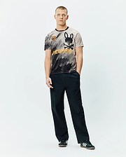 Mens Joshua Soccer Tee featuring a black and beige pixelated gradient, large black bunny skull logo, bold orange Psycho Bunny text, and a small shield patch on a classic fit jersey knit. (4)