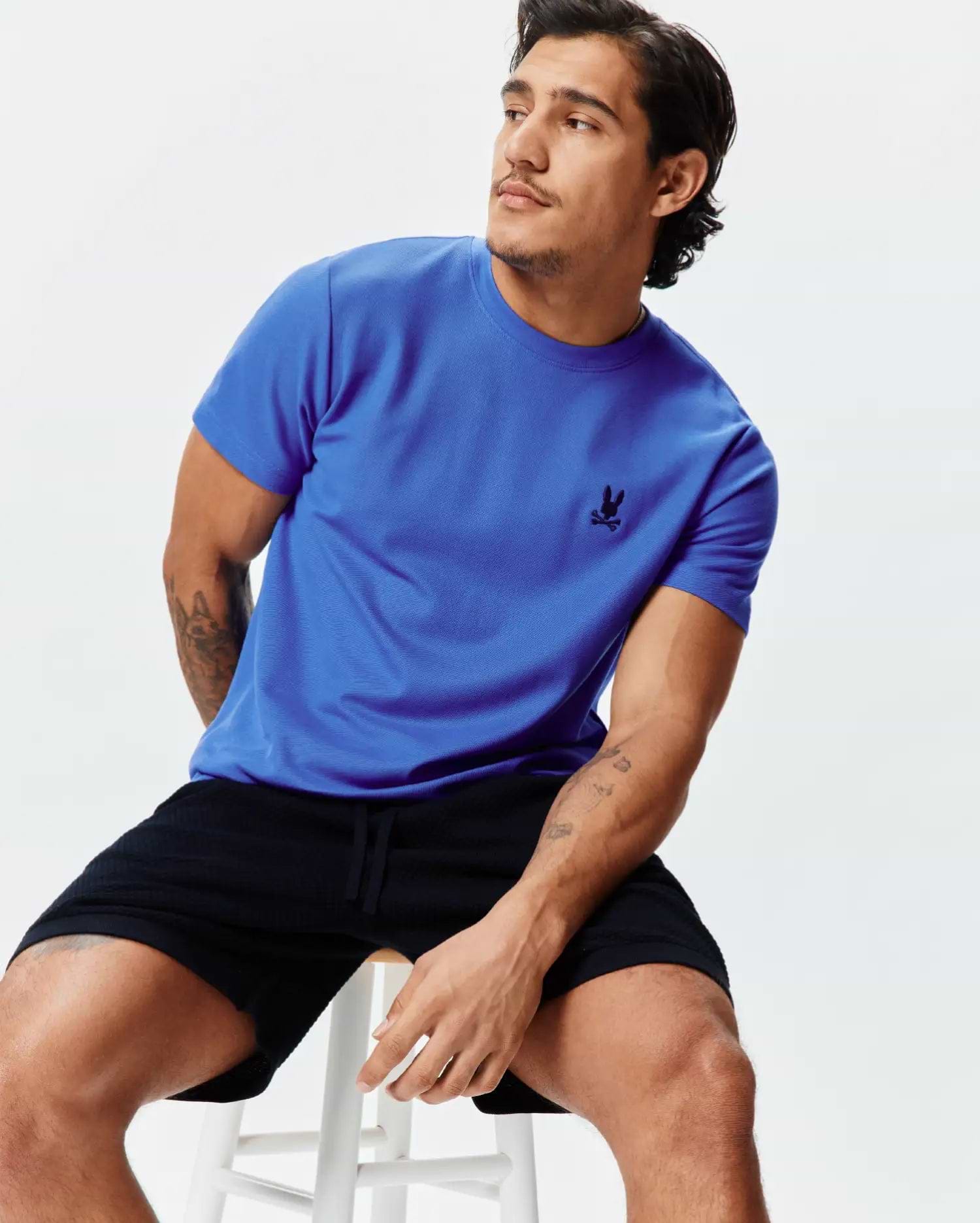 Royal blue Mens Taylor Pique Tee with a classic fit, featuring a small black embroidered Psycho Bunny skull logo on the left chest.
